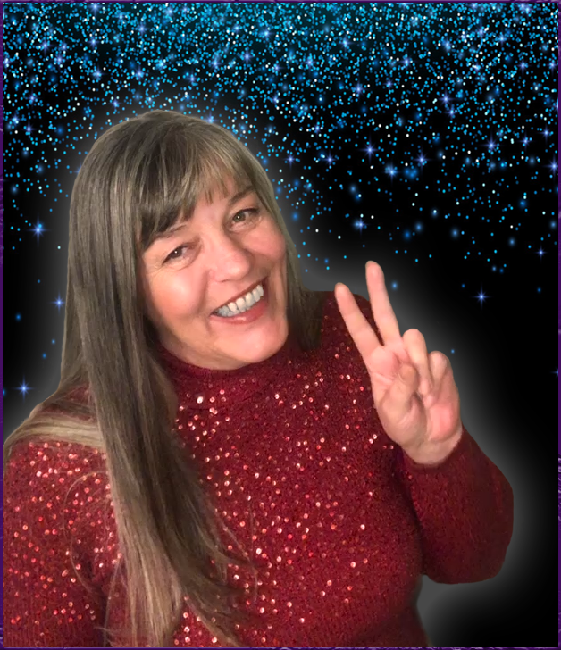 Janey Raven smiling with a peace sign.